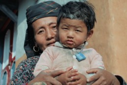 Film still - Nepali woman and child